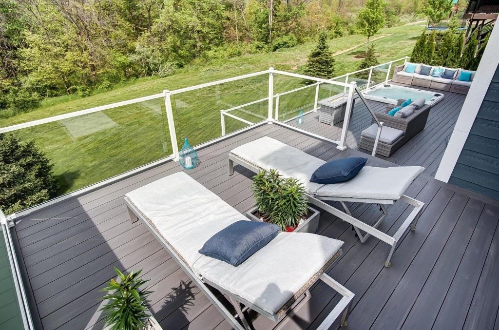 deck with plants and lounge chairs
